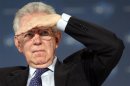 File photo shows Italy's PM Monti gesturing at the World Policy Conference in Cannes