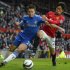 Manchester United's Shinji Kagawa challenges Chelsea's Azpilicueta during their English FA Cup quarter-final soccer match at Old Trafford in Manchester