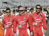 Co-drivers on the Doran Racing Ford Dallara, from left,  Brian Frisselle, Paul Tracy and Jim Lowe walk along pit road prior to the start of the Grand-Am Rolex 24 auto race at Daytona International Speedway, Saturday, Jan. 28, 2012, in Daytona Beach, Fla. (AP Photo/John Raoux)