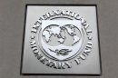 The International Monetary Fund (IMF) logo is seen at the IMF headquarters building during the 2013 Spring Meeting of the International Monetary Fund and World Bank in Washington