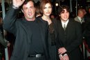 FILE - In this Dec. 5, 1996 file photo, Sylvester Stallone, left, star of the film "Daylight," arrives at the film's world premiere with his girlfriend Jennifer Flavin, center, and his son Sage Stallone, who co-stars in the film, in Hollywood district of Los Angeles. Coroner's officials determined Thursday, Aug. 30, 2012 that Sage Stallone died from a heart condition that causes blockage of the arteries and his death has been determined to be from natural causes. (AP Photo/Kevork Djansezian, File)