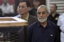 Muslim Brotherhood's Supreme Guide Mohamed Badie looks on during his trial in Cairo