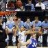 North Carolina's Kendall Marshall (5) falls after being fouled by Creighton's Ethan Wragge (34) during the second half of a third-round NCAA tournament college basketball game in Greensboro, N.C., Sunday, March 18, 2012. Marshall fractured his wrist on the play. (AP Photo/Zach Gibson)