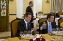 New York Governor Andrew Cuomo toasts with a mojito during a meeting at the Hotel Nacional in Havana, Cuba, Monday, April 20, 2015. Cuomo is the first U.S. governor to visit Cuba since the Dec. 17 declaration of detente. At right is Gustavo Machin, Cuba's deputy chief of North American affairs.(AP Photo/Ramon Espinosa,Pool)