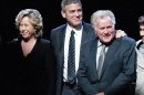 From left to right, actress Yeardley Smith, actor George Clooney, and actor Martin Sheen take a bow during the curtain call at the Los Angeles premiere of the play 