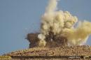 This undated photo released on June 22, 2015, by a militant website, which has been verified and is consistent with other AP reporting, shows one of two mausoleums blowing up by the Islamic State militants, in the historic central town of Palmyra, Syria. A Syrian official says the Islamic State group has destroyed two mausoleums in the historic central town of Palmyra. Maamoun Abdulkarim, the head of the Antiquities and Museums Department in Damascus, tells The Associated Press that one of the tombs belongs to Mohammad Bin Ali, a descendant of Islam's Prophet Muhammad's cousin Imam Ali. (The website of Islamic State militants via AP)
