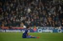 Chelsea's Brazilian-born Spanish striker Diego Costa sits on the pitch before receiving medical treatment during a League Cup fourth round football match against Stoke City at the Britannia Stadium in Stoke-on-Trent, on October 27, 2015