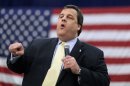 In this March 29, 2012 photo, New Jersey Gov. Chris Christie addresses a crowd at a town hall meeting in Manchester, N.J. Part stump speech, part quiz show, part comedy hour, Chris Christie's town halls are probably not what Norman Rockwell envisioned in his famous 1943 painting of an assembly where people come to air their grievances and an elected official listens patiently. Yet the time-old tradition of the town hall has become the hallmark of Christie's administration and helped make him a rising Republican star. (AP Photo/Mel Evans)
