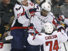 Washington Capitals right wing Joel Ward, center, is congratulated by teammates after his goal against the Boston Bruins during overtime of Game 7 of an NHL hockey Stanley Cup first-round playoff series, in Boston on Wednesday, April 25, 2012. The Capitals won 2-1. From left with Ward are Karl Alzner and John Carlson. (AP Photo/Charles Krupa)