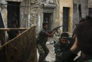 Syrian rebels battle with regime forces in the Askar neighbourhood of Aleppo. UN rights investigators have warned that crimes against humanity are taking place in war-ravaged Syria, as they vowed to identify those behind the atrocities and seek a meeting with Syrian President Bashar al-Assad