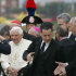 ** FILE ** In this Monday, April 21, 2008 file photo, Pope Benedict XVI, left, arrives at the Italian air force 31st Squadron base in Ciampino, 30 kilometers south-east of Rome, on his way back from a six-day trip to the U.S. including the U.N. and Ground Zero in N.Y.C.  The Vatican has confirmed Saturday, May 26, 2012, that the pope's butler Paolo Gabriele, at right carrying bags, was arrested in an embarrassing leaks scandal. Spokesman Rev. Federico Lombardi said Paolo Gabriele, a layman, was arrested in his home inside Vatican City with secret documents in his possession.  Vatican documents leaked to the press in recent months have pointed to power struggles and accusations of corruption touching senior Vatican cardinals.(AP Photo/Domenico Stinellis)