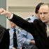 Accused Norwegian Anders Behring Breivik gestures as he arrives at the courtroom, Monday, April 16, 2012 in Oslo, Norway. The terror trial against an anti-Muslim fanatic who confessed to killing 77 people in Norway starts amid worries that he will use the proceedings to showcase his radical views. After opening statements, Anders Behring Breivik is set to testify for five days, explaining why he set off a bomb in downtown Oslo, killing eight, and then shot to death 69 people, mostly teenagers, at a Labor Party youth camp on Utoya island, outside the Norwegian capital.(AP Photo/Hakon Mosvold Larsen, Pool)