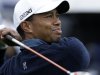 Tiger Woods watches his tee shot on the 18th hole of the north course at the Torrey Pines Golf Course during the second round of the Farmers Insurance Open golf tournament, Friday, Jan. 25, 2013, in San Diego. (AP Photo/Gregory Bull)