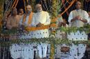 Modi watches a ritual known as Aarti during evening prayers at Varanasi