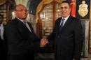 Tunisian President Moncef Marzouki (R) shakes hands with the new Prime Minister Mehdi Jomaa at a new government presentation ceremony on Januay 25, 2014 in Carthage Palace in Tunis