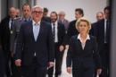 German Defence Minister Ursula von der Leyen (R) and German Foreign Minister Frank-Walter Steinmeier arrive for a press conference on November 26, 2015 at the lower house of German parliament (Bundestag) in Berlin