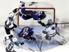 St. Louis Blues' Vladimir Sobotka, top, of the Czech Republic, goes flying into the goal over San Jose Sharks goalie Antti Niemi, right, of Finland, and Blues' Scott Nichol (12) as Sharks' Dominic Moore (18) and Justin Braun (61) watch during the second period in Game 2 of an NHL Stanley Cup first-round hockey playoff series Saturday, April 14, 2012, in St. Louis. (AP Photo/Jeff Roberson)