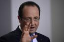 French President Francois Hollande gives a press conference in Brussels on December 20, 2013