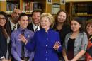 Democratic presidential candidate Hillary Clinton (C) poses with students and faculty at Rancho High School on May 5, 2015 in Las Vegas, Nevada