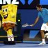 Federer of Switzerland hits a ball into the back of a man dressed as the cartoon character Sponge Bob Square Pants during Kids Tennis Day in Melbourne