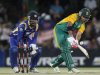 South Africa's JP Duminy plays a shot as Sri Lanka's wicket keeper Kumar Sangakkara looks on during their third one-day international cricket match in Bloemfontein