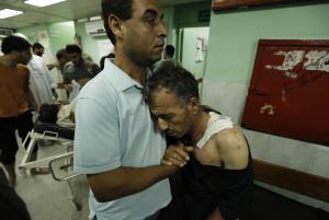 A Palestinian hugs his father who was wounded in an &hellip;