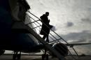 U.S. Secretary of State John Kerry steps from his plane upon his arrival in Vienna