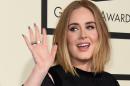 Singer Adele arrives on the red carpet during the 58th Annual Grammy Music Awards in Los Angeles February 15, 2016