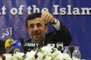Iran's President Ahmadinejad speaks during a media conference at Iran's embassy after he attended the Developing-8 summit in Islamabad