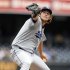 Los Angeles Dodgers' Clayton Kershaw delivers a pitch in the first inning of a baseball game against the San Diego Padres, Sunday, Sept. 25, 2011, in San Diego. (AP Photo/Chris Park)