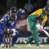 South Africa's JP Duminy plays a shot as Sri Lanka's wicket keeper Kumar Sangakkara looks on during their third one-day international cricket match in Bloemfontein