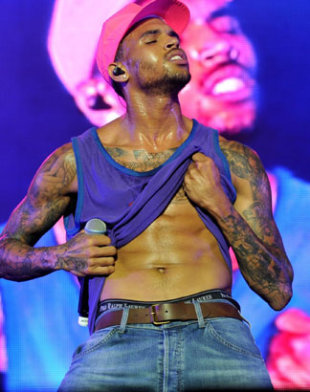 PHOTOS: Chris Brown Kisses Fan During Performance At Supafest 2012