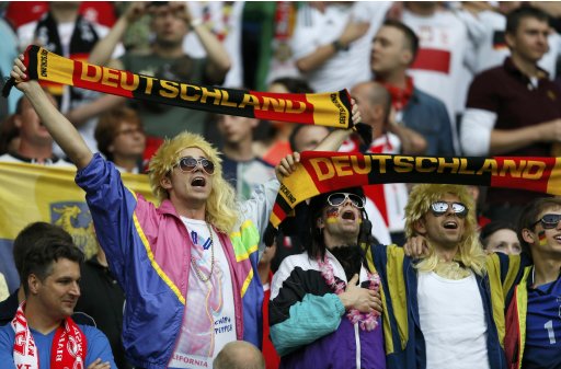 Germany's fans cheer before their Euro 2012 semi-final soccer match against Spain at the National stadium in Warsaw
