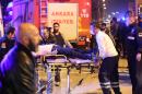An injured person receives medical treatment by rescue workers following an explosion in Ankara on February 17, 2016