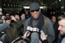 Former NBA star Dennis Rodman speaks to the media at the Pyongyang Airport in Pyongyang, before he leaves North Korea Friday, March 1, 2013. Ending his unexpected round of basketball diplomacy in North Korea on Friday, Rodman called leader Kim Jong Un an "awesome guy" and said his father and grandfather were "great leaders." (AP Photo/Kyodo News) JAPAN OUT, MANDATORY CREDIT, NO LICENSING IN CHINA, HONG KONG, JAPAN, SOUTH KOREA AND FRANCE