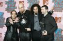 US band System of a Down poses backstage at the MTV European Music Awards after winning best alternative act on November 3, 2005 in Lisbon