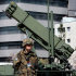 FILE - In this March 29, 2009 file photo, PAC-3 land-to-air missiles are deployed at the Defense Ministry in Tokyo as part of Japan's military mobilization to protect the country from any threat if North Korea's looming rocket launch fails. Japan's Defense Minister Naoki Tanaka on Friday ordered missile units to intercept a rocket expected to be launched by North Korea next month if it flies over Japan. (AP Photo/Itsuo Inouye, File)