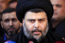 Firebrand Shiite cleric Muqtada al-Sadr speaks to the press at Our Lady of Salvation church in Baghdad, Iraq, Friday, Jan. 4, 2013. Al-Sadr paid a visit Friday to a Baghdad church that was the scene of a deadly 2010 attack as well as one of the Iraqi capital's main Sunni mosques, an apparent overture to other religious groups as opposition mounts against his rival, Prime Minister Nouri al-Maliki. (AP Photo/ Karim Kadim)