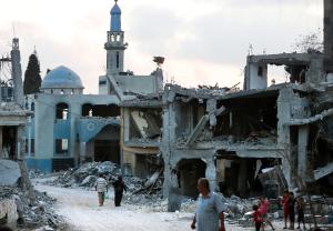 Palestinians flee their destroyed neighbourhood to &hellip;