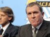 Manchester City manager Roberto Mancini looks on as Garry Cook (right) speaks during a press conference in Manchester