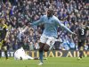 Manchester City's Yaya Toure, centre, celebrates after scoring against Chelsea during their English Premier League soccer match at The Etihad Stadium, Manchester, England, Sunday Feb. 24, 2013. (AP Photo/Jon Super)
