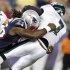 Patriots linebacker Jermaine Cunningham sacks Eagles quarterback Michael Vick during the first quarter of their preseason NFL football game in Foxborough