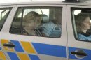 Head of Czech PM Necas' office, Jana Nagyova, sits in a police car as she is arrested for abuse of power and bribery in Ostrava