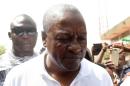 President and candidate of Ghana's ruling National Democratic Congress party John Mahama leaves after voting in the Bole district, northern region, on December 7, 2016