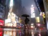 A man walks in Times Square as  Hurricane Irene arrives in New York, on Sunday, Aug. 28, 2011. (AP Photo/Mike Groll)