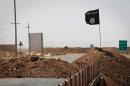 A flag of the Islamic State (IS) is seen in Rashad, on the road between Kirkuk and Tikrit, on September 11, 2014