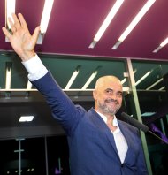 Opposition Socialist Party leader Edi Rama gestures as he gives his victory speech at party headquarters in Tirana, Albania, calling on the governing Democratic Party of Prime Minister Sali Berisha to acknowledge its loss, after counting results show a clear lead of his party, Tuesday, June 25, 2013. Albania’s national elections were seen as key test for the country’s hopes for closer ties with the European Union. (AP Photo/Hektor Pustina)