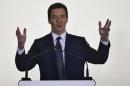 Britain's Chancellor of the Exchequer Osborne speaks during a news conference in Mumbai