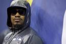 Seattle Seahawks' Marshawn Lynch stands against a wall during media day for the NFL Super Bowl XLVIII football game Tuesday, Jan. 28, 2014, in Newark, N.J. (AP Photo/Matt Slocum)