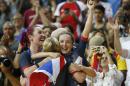 Britain's Elinor Barker (R) and Katie Archibald (L) celebrate after winning gold in the women's team pursuit finals track cycling event on August 13, 2016